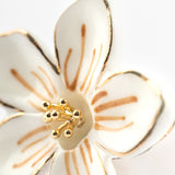 White flower pin