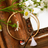 Adjustable cat bracelet with pompom