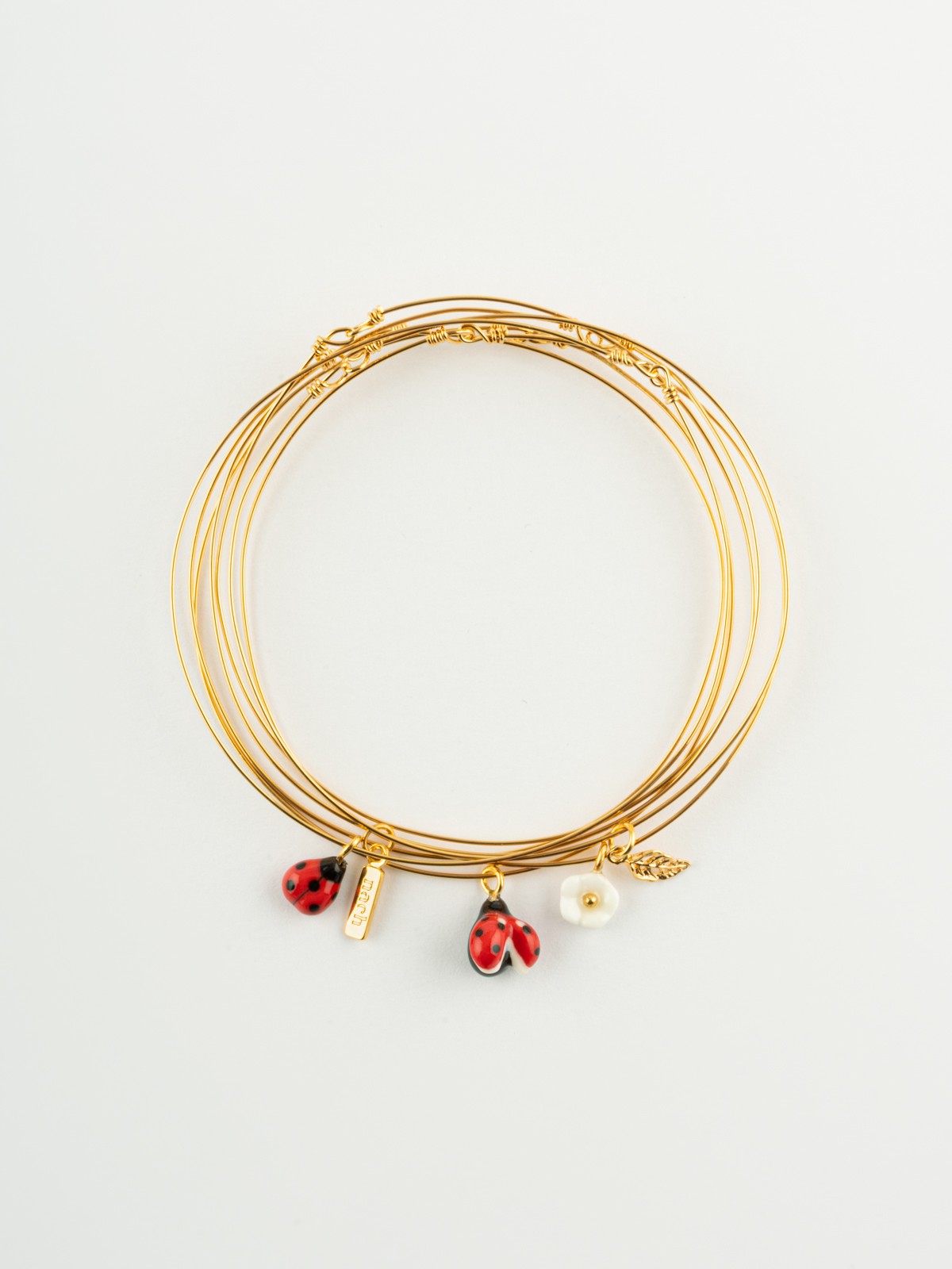 Bracelet semainier doré coccinelle