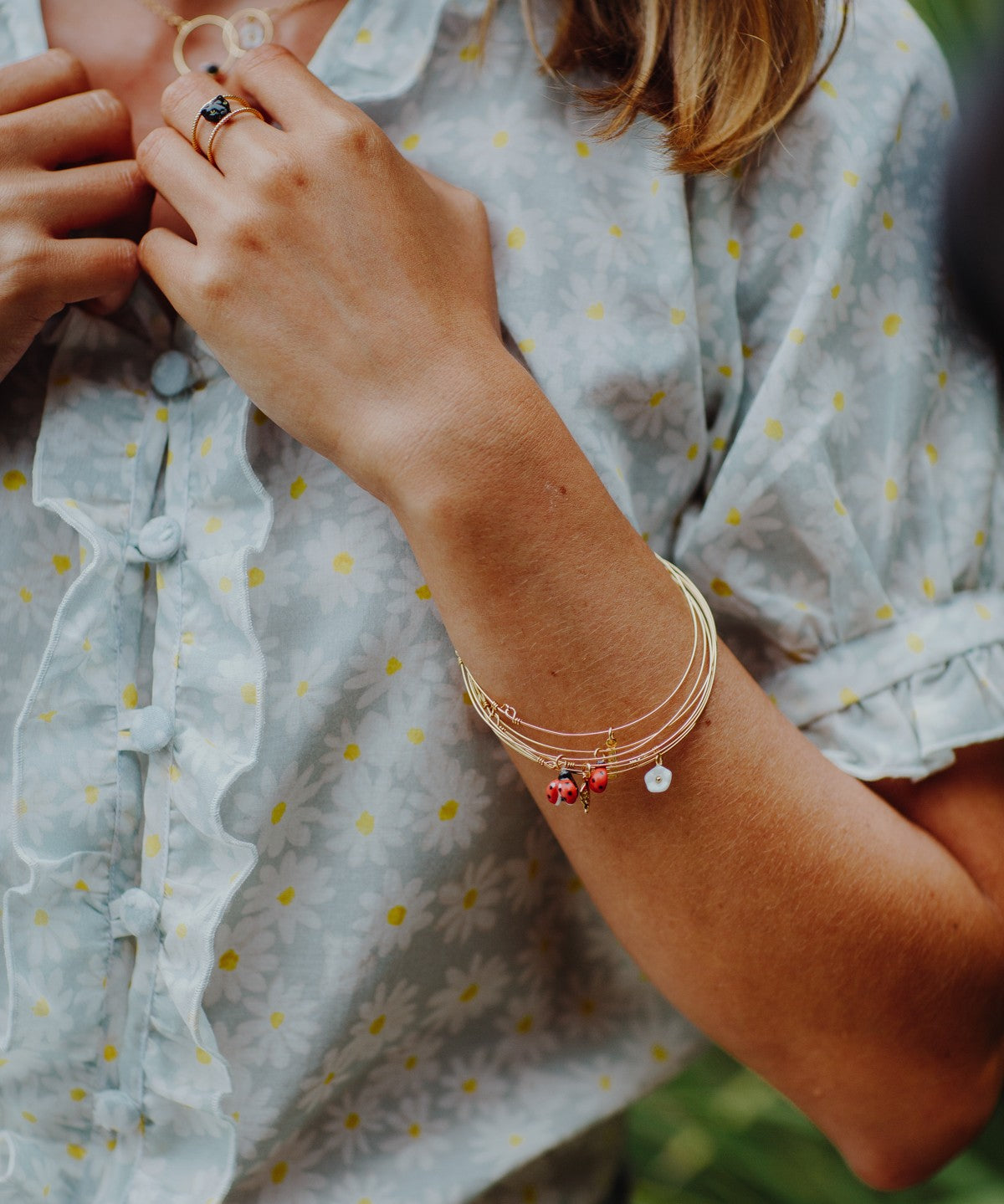 Bracelet semainier doré coccinelle