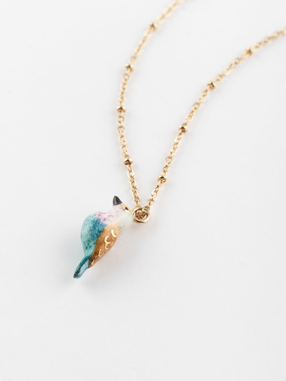 Collier oiseau rose et bleu