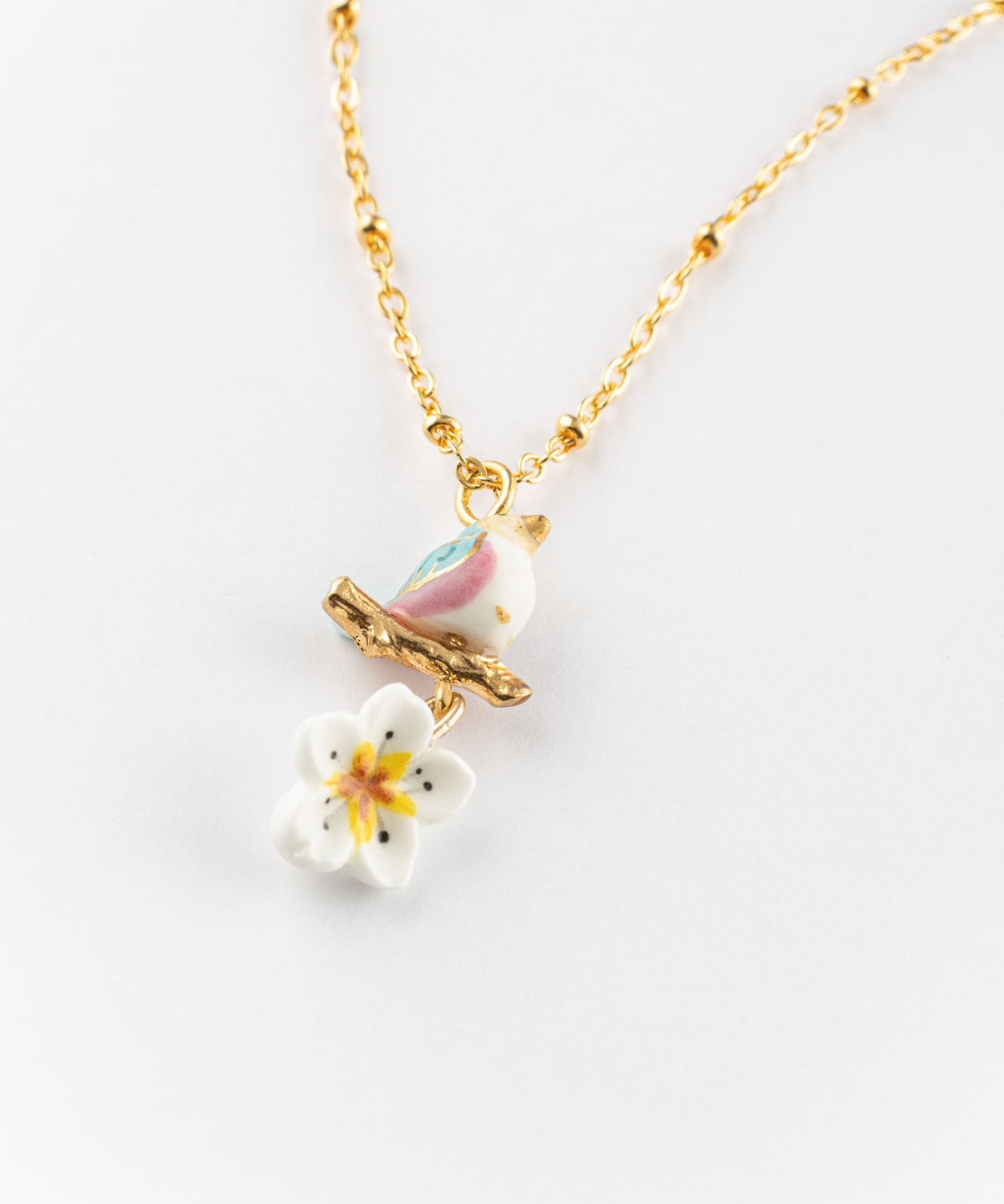 Collier oiseau sur branche et fleur